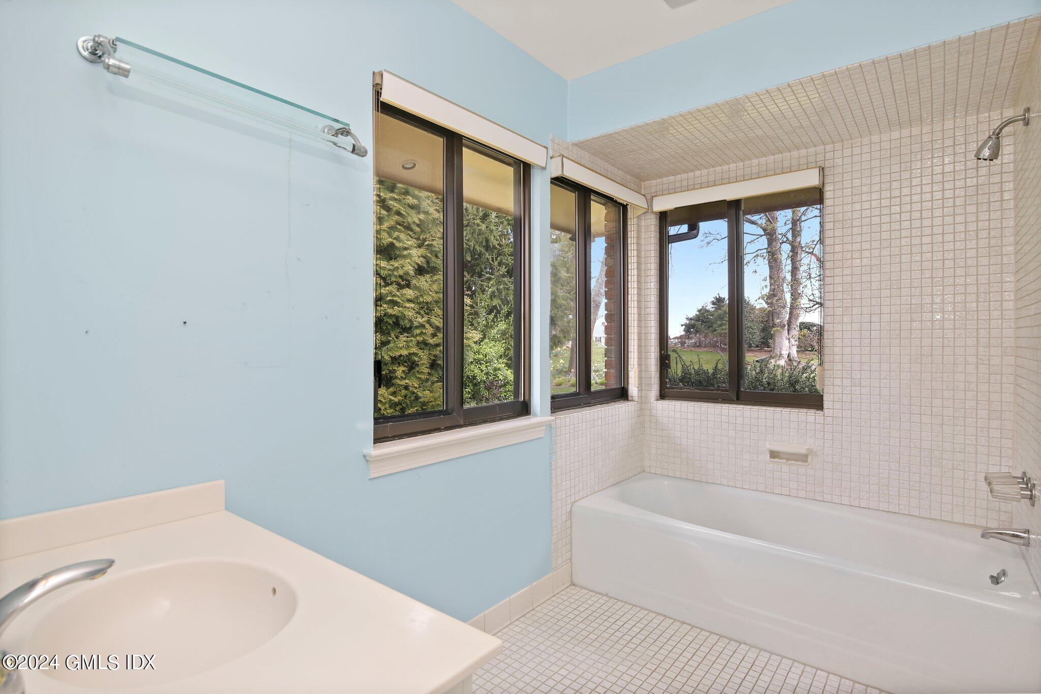 1 Seagate Road Riverside, CT 06878 - Photo 8 of 16 a bathroom with a bathtub and a shower