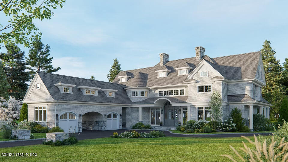 1 Seagate Road Riverside, CT 06878 - Photo 9 of 16 a front view of house with yard and green space
