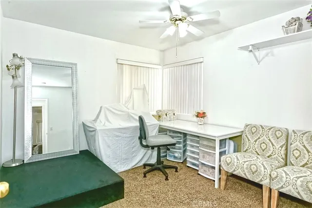a view of a livingroom with furniture and window