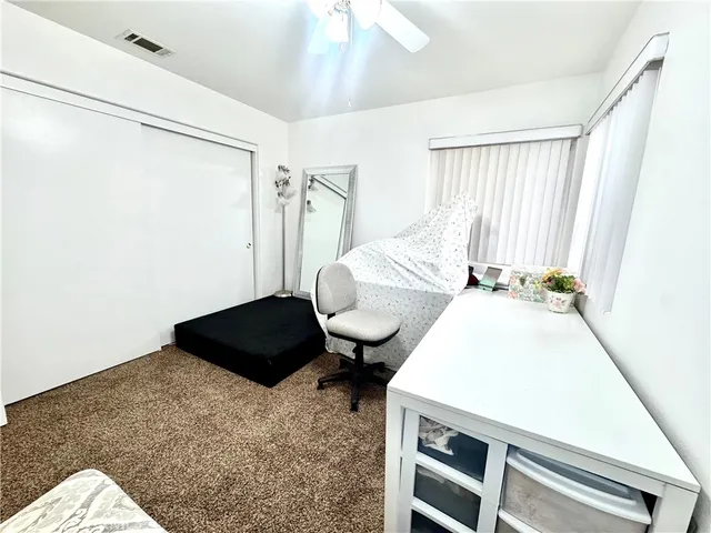 a bedroom with a bed and a shower