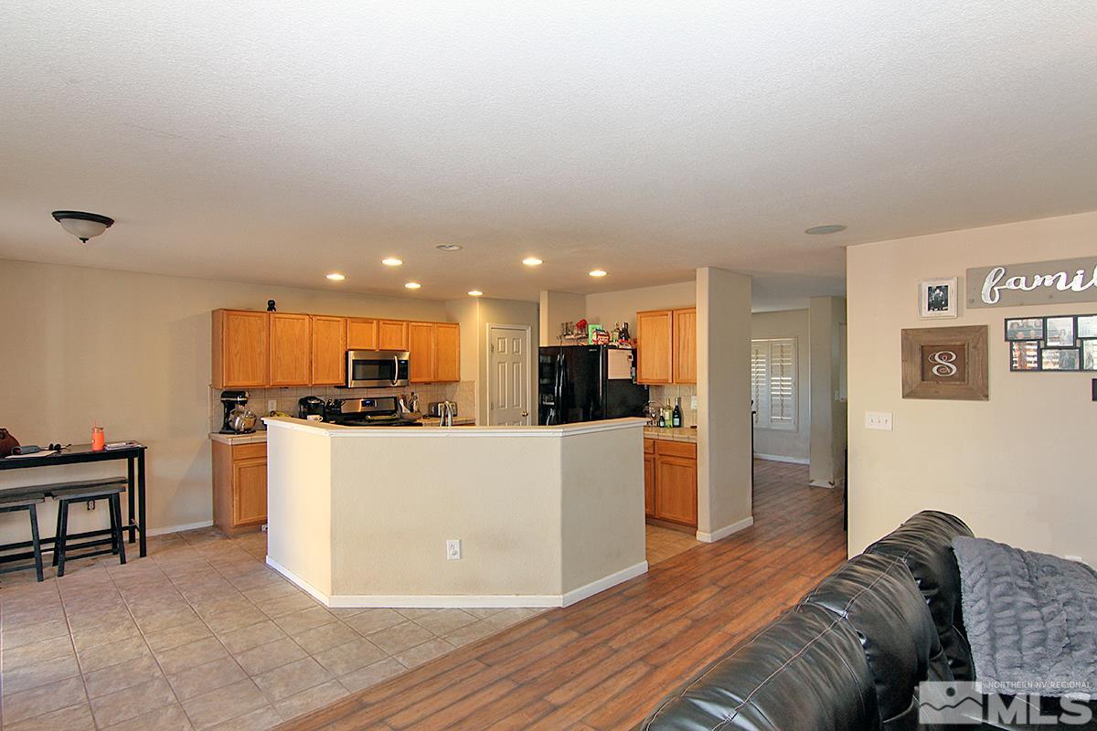 8951 Kemmer Street Reno, NV 89506 - Photo 3 of 12 a living room with furniture and kitchen view
