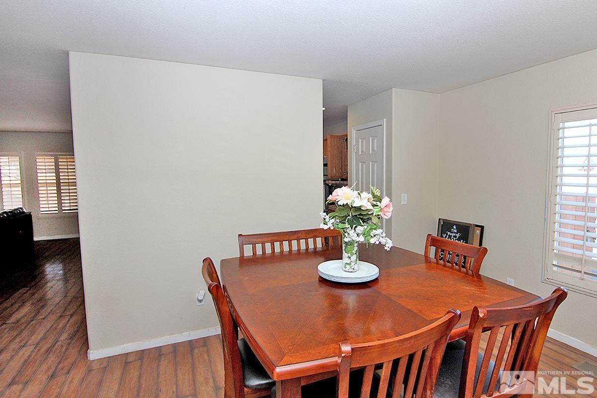 8951 Kemmer Street Reno, NV 89506 - Photo 5 of 12 a view of a dining room with furniture and wooden floor