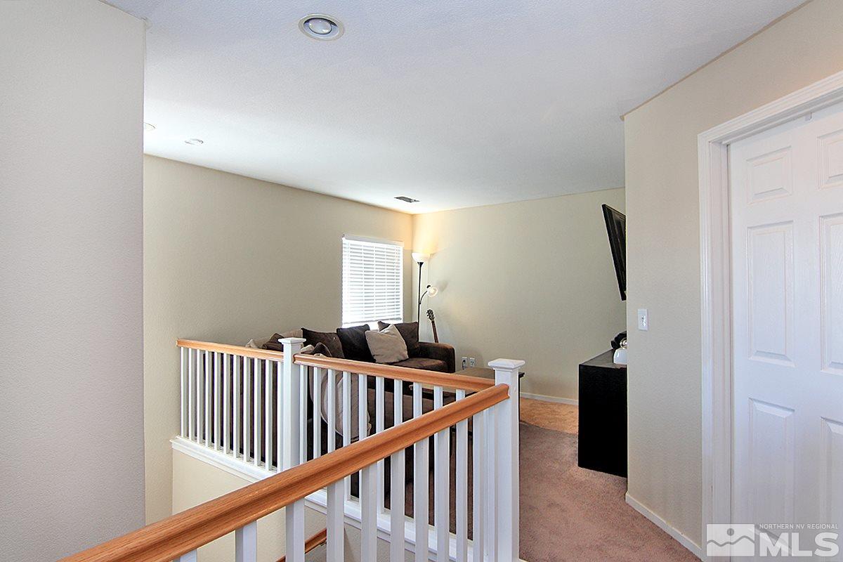 8951 Kemmer Street Reno, NV 89506 - Photo 8 of 12 a view of staircase with rug floor