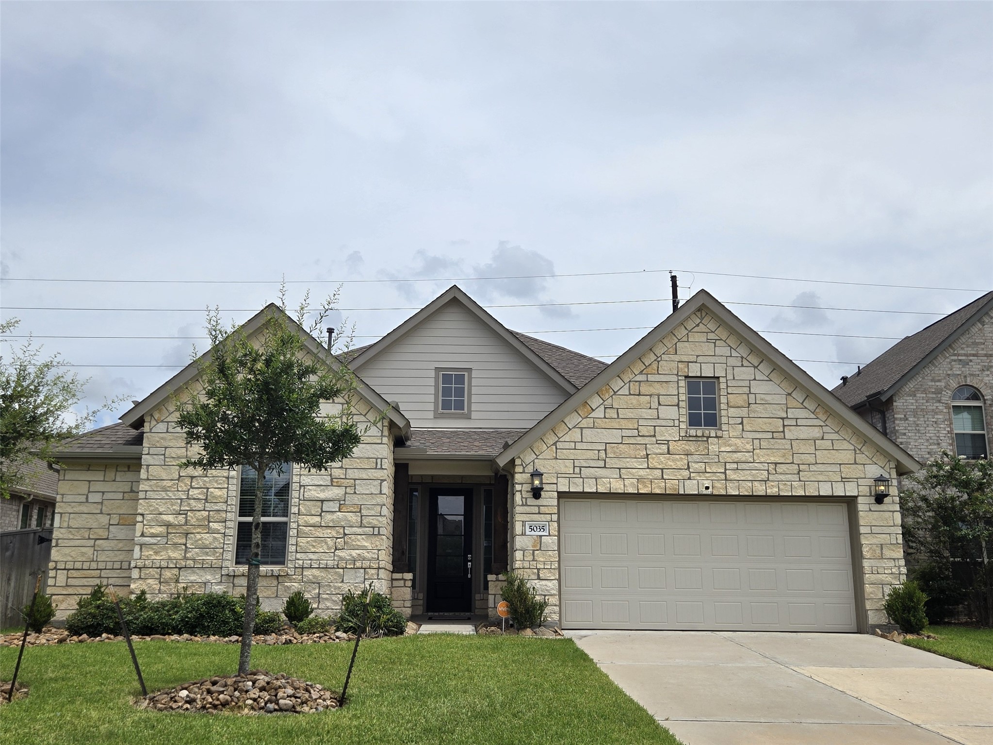 5035 Sierra Ridge Drive Rosenberg, TX 77469 - Photo 1 of 26 This captivating home features a beautifully designed stone façade and inviting entryway, exuding charm and elegance.