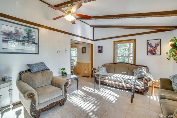 a living room with furniture and a window