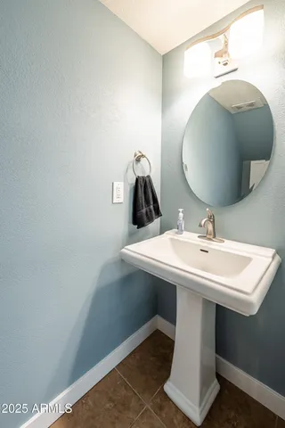 a view of a livingroom with a ceiling fan and window