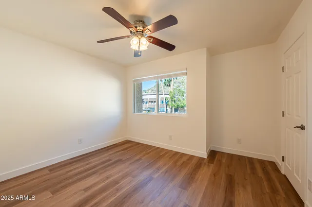 a view of a chairs and table in the patio