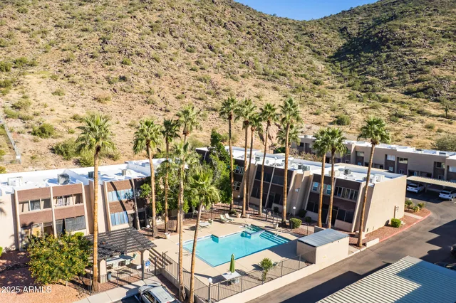 a couple of cars parked in front of a building