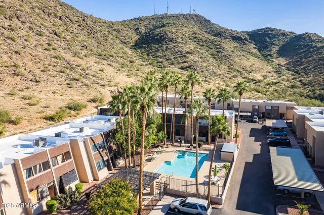 a view of a patio with iron fence
