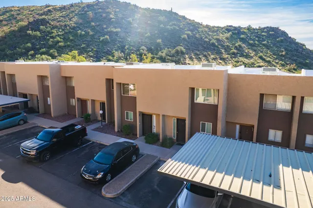 a swimming pool with outdoor seating and yard