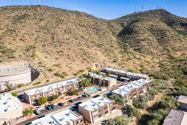 an aerial view of residential house and green space