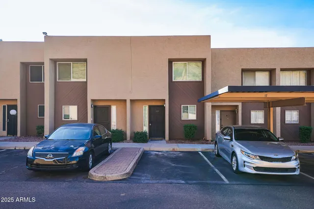 a front view of a house with a garden and patio