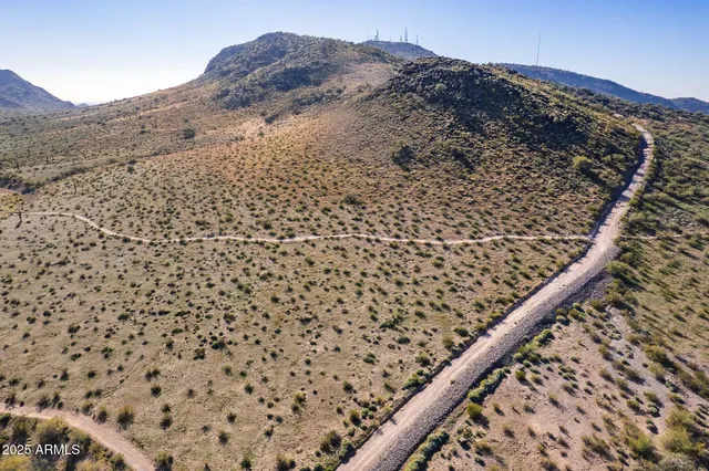 an aerial view of mountain with an outdoor space