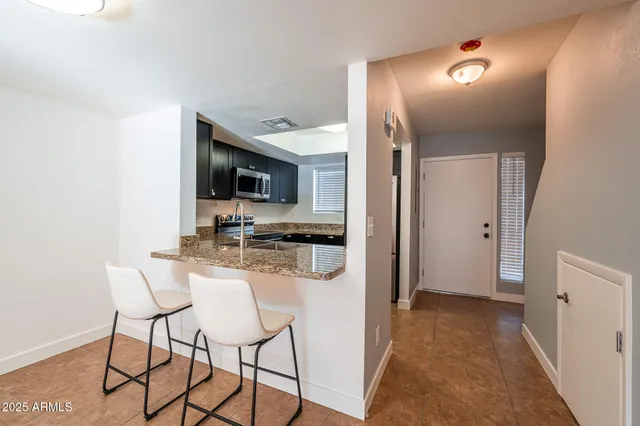a view of a kitchen from the hallway