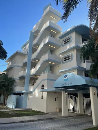 a view of a house with a yard and balcony