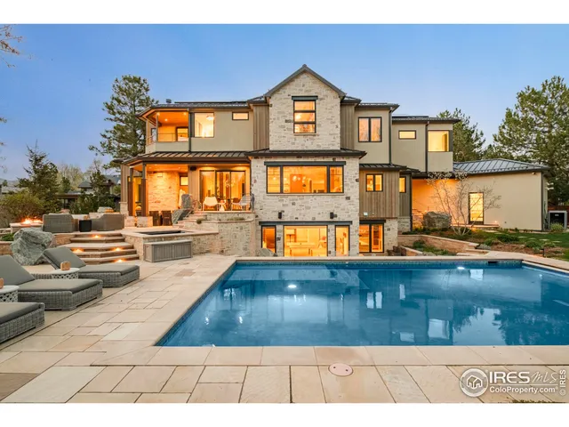 a view of a swimming pool with an outdoor seating