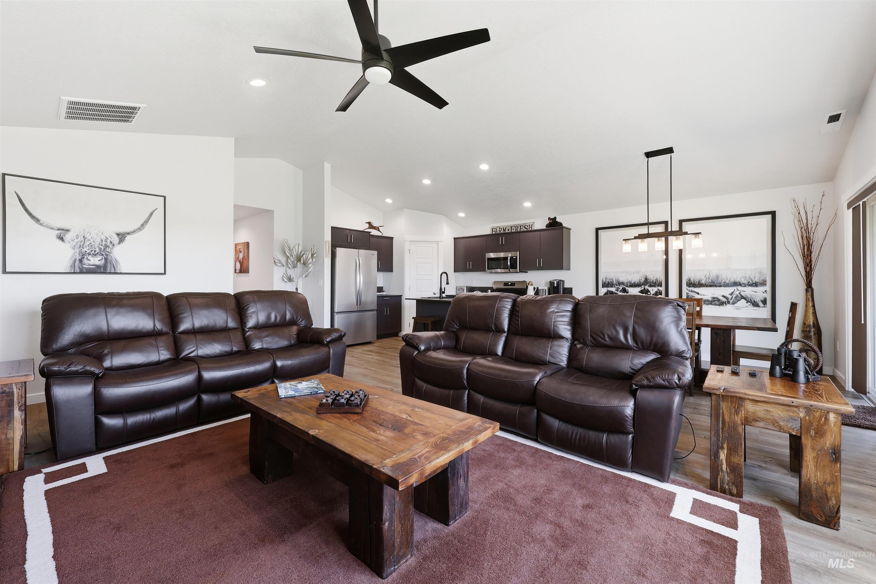 3811 West Maypearl Street Meridian, ID 83642 - Photo 14 of 39 Open-concept living space featuring wood-finish flooring, recessed lighting, and a contemporary ceiling fan