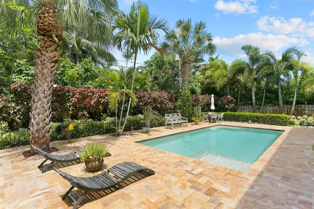 a view of a swimming pool with a patio