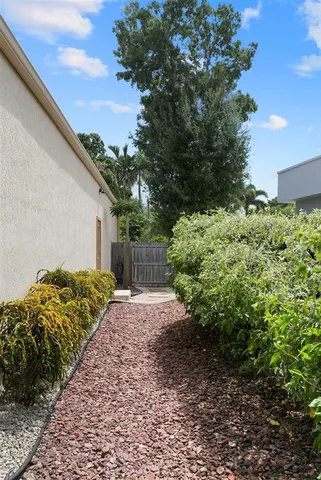 a backyard of a house with lots of green space