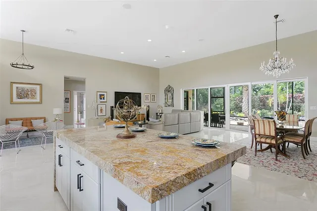 a view of a living room and kitchen