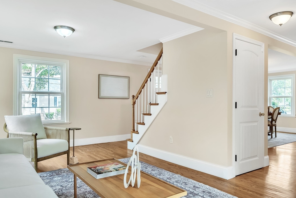 141 Renfrew Street Arlington, MA 02476 - Photo 11 of 41 a living room with furniture and wooden floor