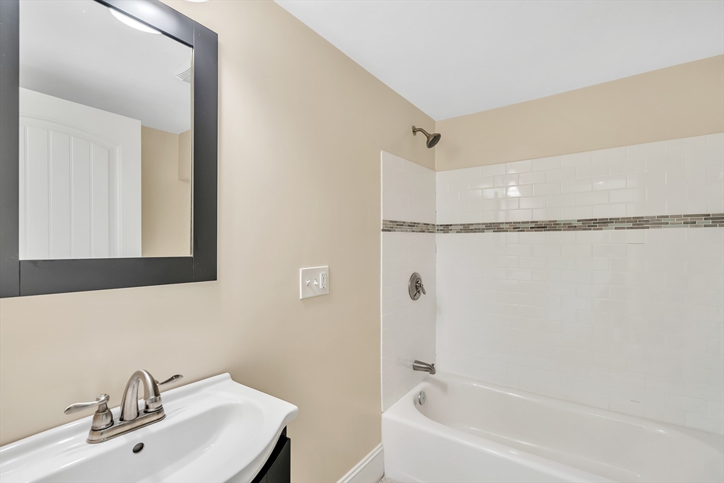 141 Renfrew Street Arlington, MA 02476 - Photo 19 of 41 a bathroom with a shower and a sink