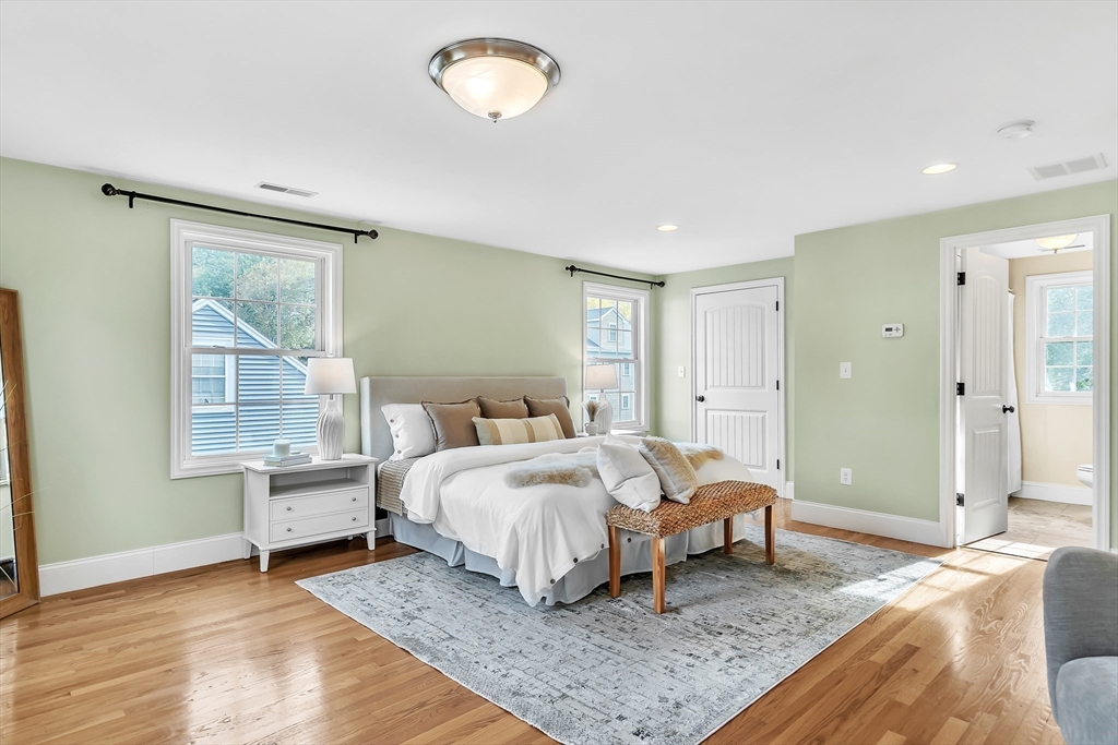 141 Renfrew Street Arlington, MA 02476 - Photo 21 of 41 a bed room with a bed and window