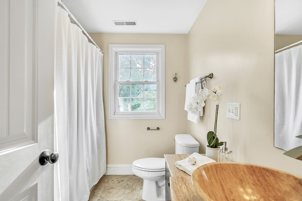 141 Renfrew Street Arlington, MA 02476 - Photo 26 of 41 a bathroom with a sink toilet and shower