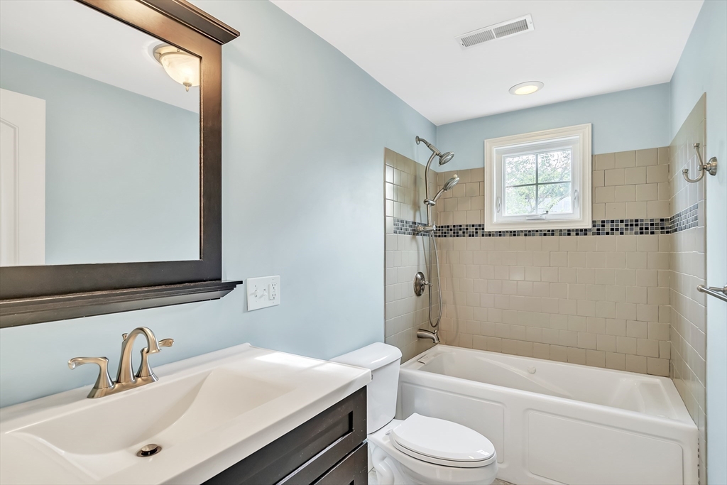 141 Renfrew Street Arlington, MA 02476 - Photo 27 of 41 a bathroom with a sink mirror toilet and bathtub