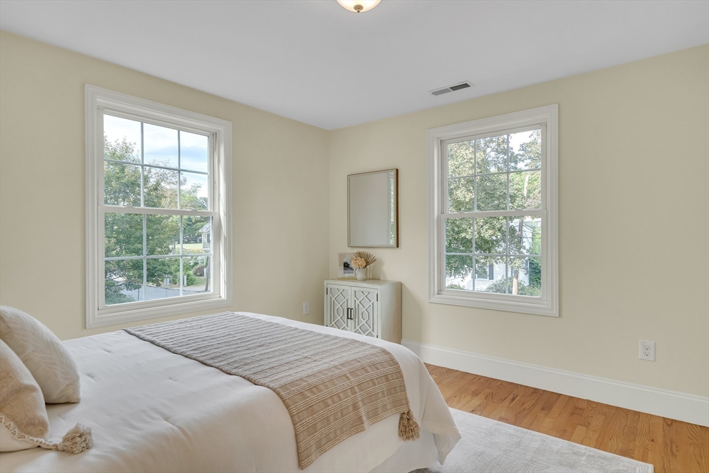 141 Renfrew Street Arlington, MA 02476 - Photo 28 of 41 a bedroom with a bed and a window