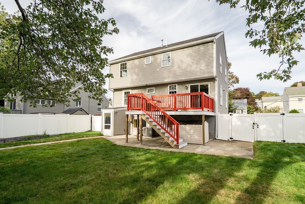 141 Renfrew Street Arlington, MA 02476 - Photo 40 of 41 front view of house with a yard