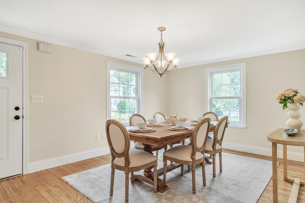 141 Renfrew Street Arlington, MA 02476 - Photo 4 of 41 a view of a dining room with furniture and window