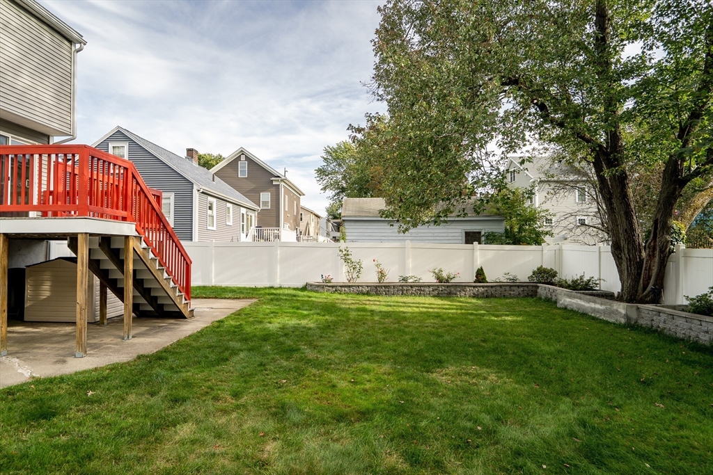 141 Renfrew Street Arlington, MA 02476 - Photo 41 of 41 a view of a house with a yard and sitting area