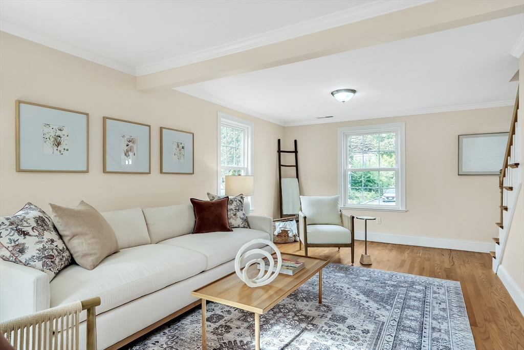 141 Renfrew Street Arlington, MA 02476 - Photo 10 of 41 a living room with furniture a rug and a window