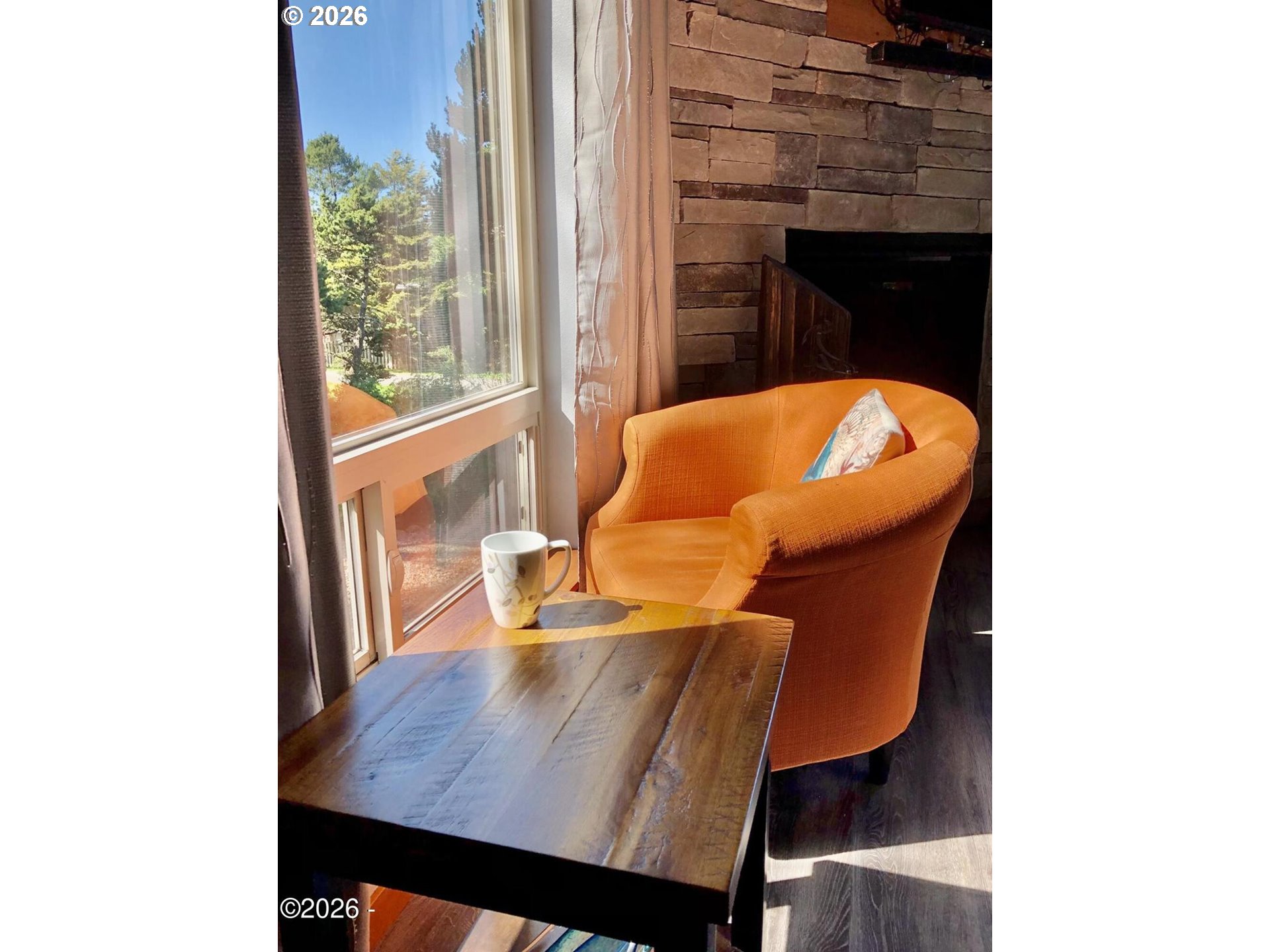 15 Shell Street Yachats, OR 97498 - Photo 13 of 47 a view of a dining room with furniture and wooden floor