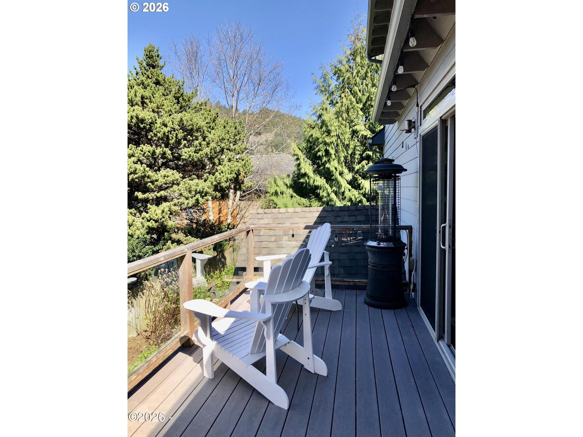 15 Shell Street Yachats, OR 97498 - Photo 15 of 47 a balcony with wooden floor and bench
