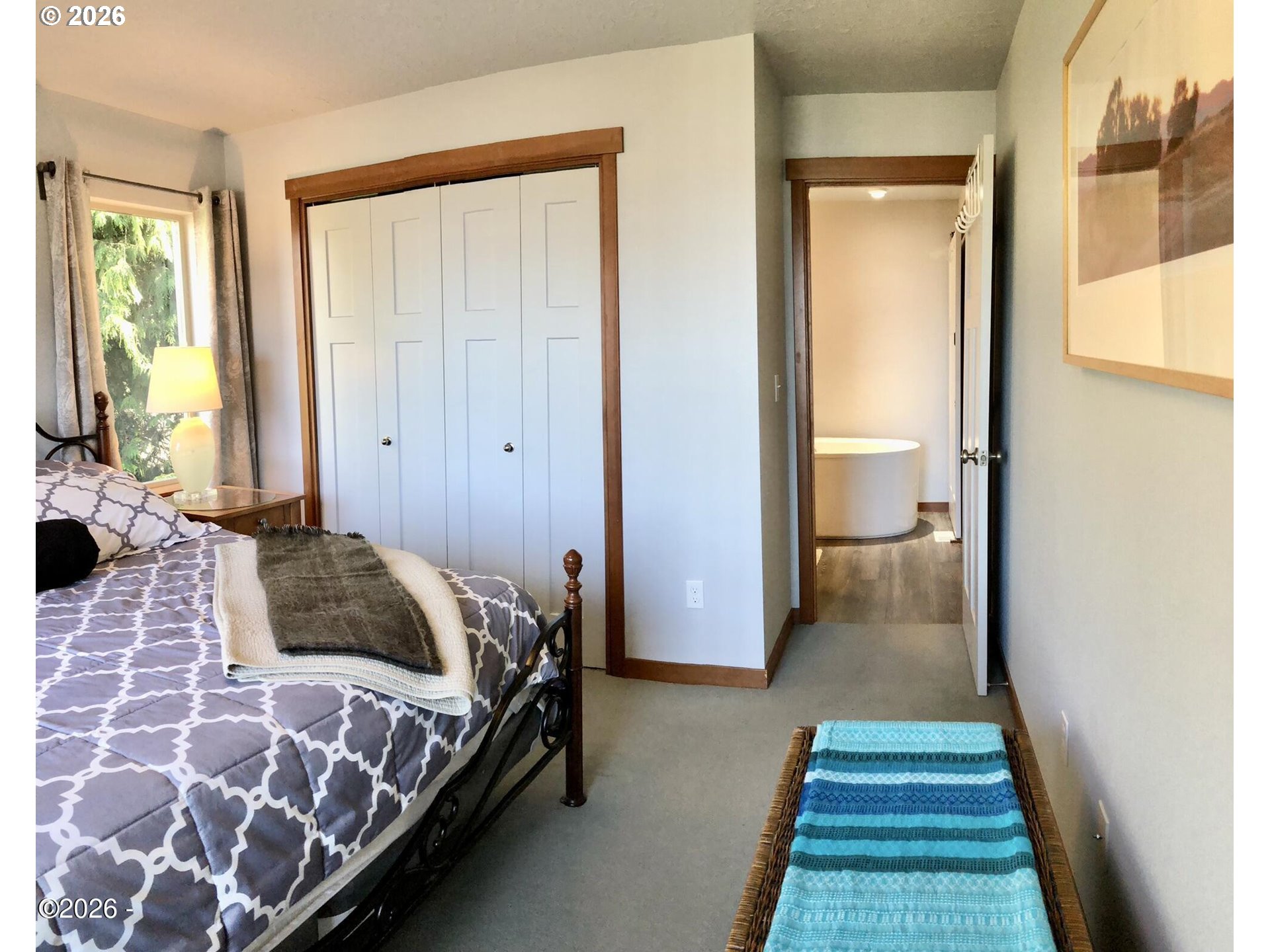 15 Shell Street Yachats, OR 97498 - Photo 22 of 47 a bedroom with a bed and wooden floor