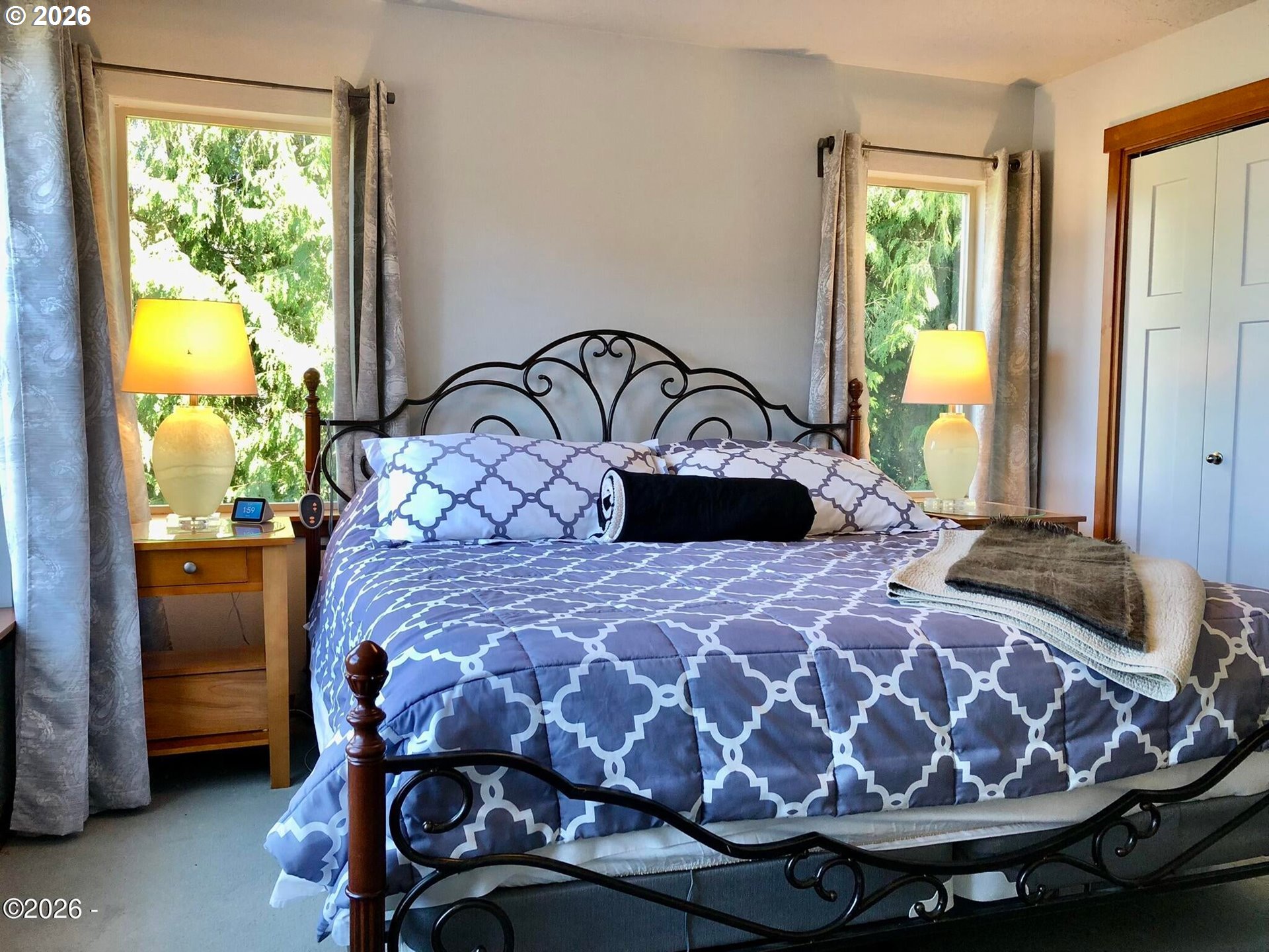 15 Shell Street Yachats, OR 97498 - Photo 23 of 47 a bed sitting in a bedroom next to a window
