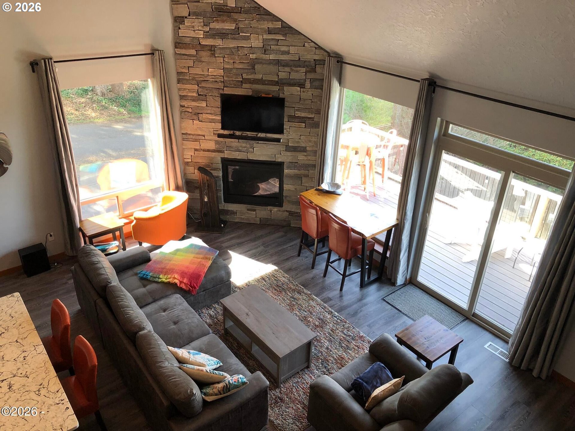 15 Shell Street Yachats, OR 97498 - Photo 25 of 47 a living room with furniture and a fireplace