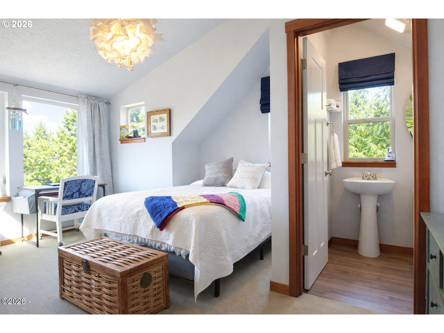 15 Shell Street Yachats, OR 97498 - Photo 27 of 47 a bedroom with a bed and a window with chair