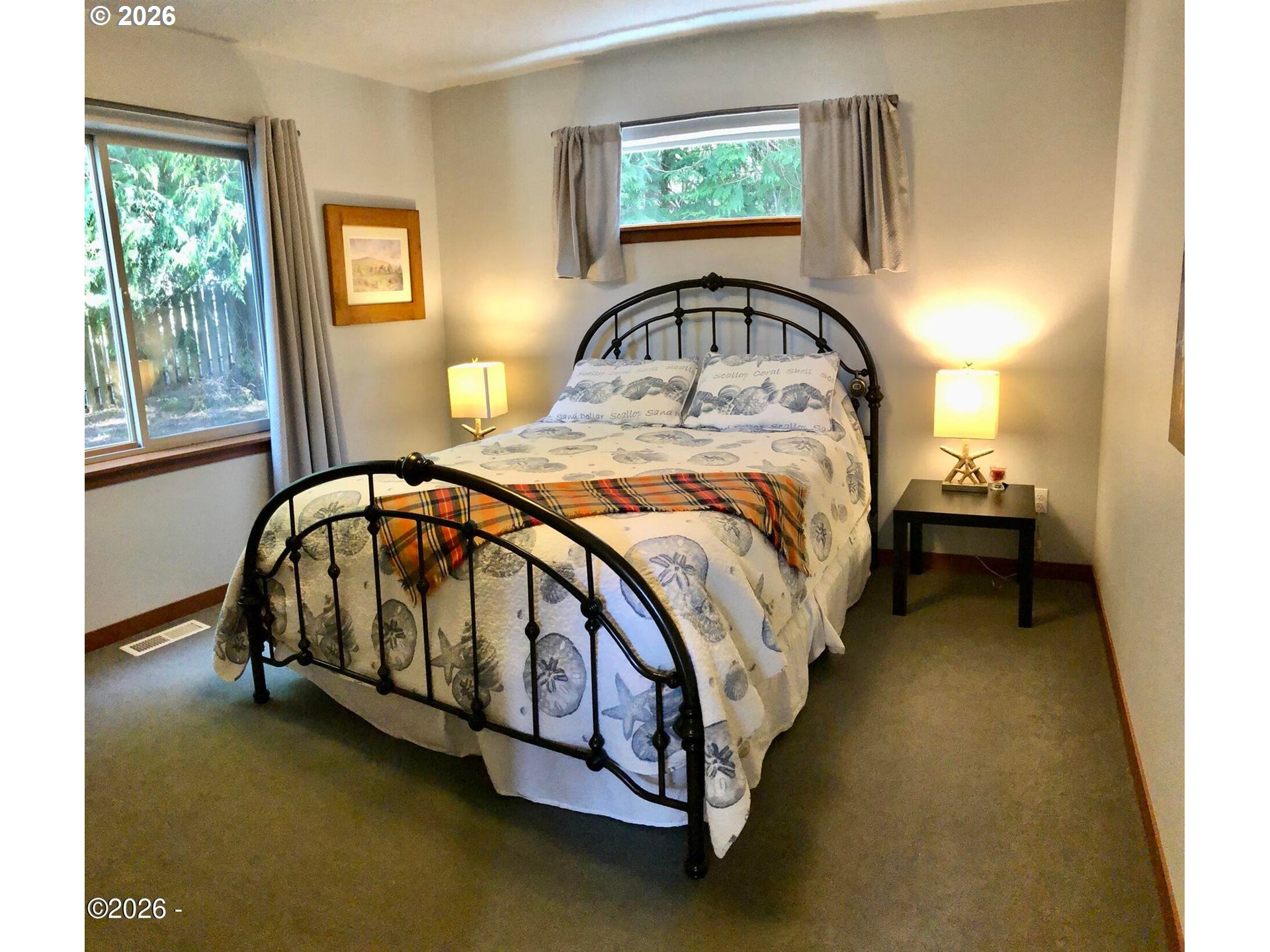 15 Shell Street Yachats, OR 97498 - Photo 32 of 47 a bedroom with a bed and window