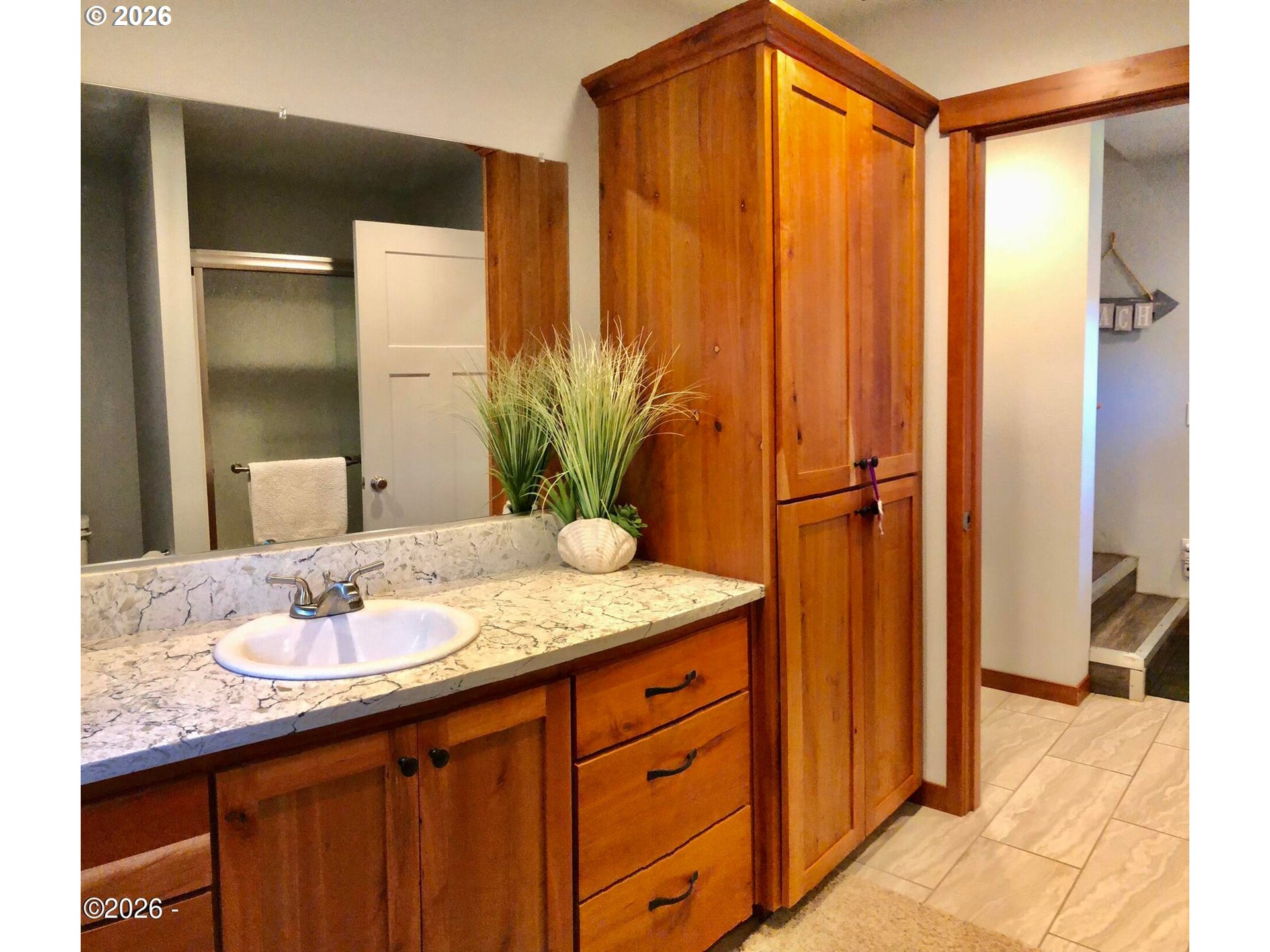 15 Shell Street Yachats, OR 97498 - Photo 33 of 47 a bathroom with a granite countertop sink and a mirror