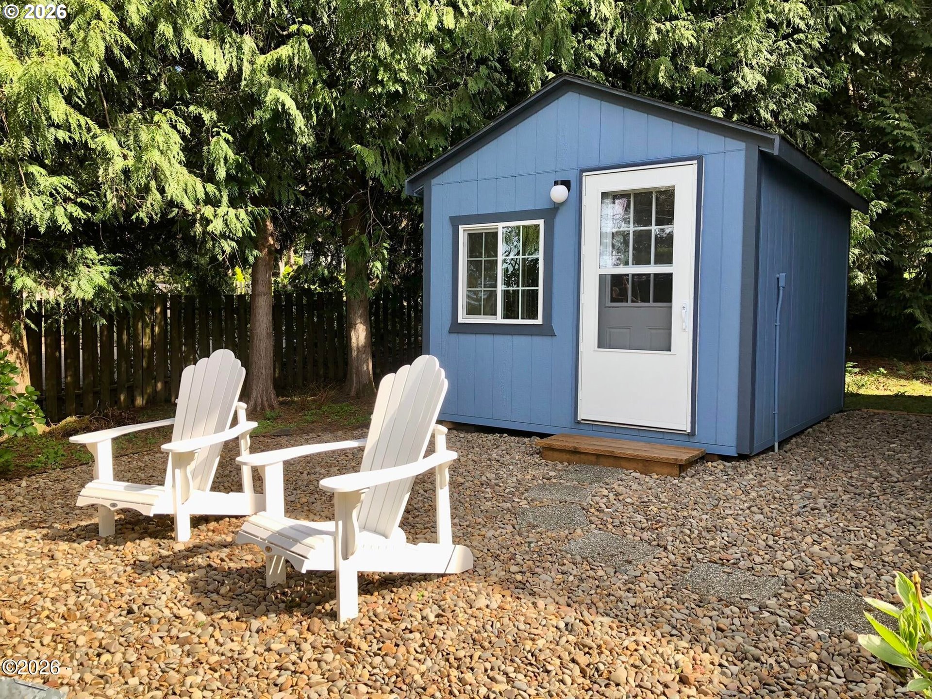 15 Shell Street Yachats, OR 97498 - Photo 36 of 47 a view of a house with backyard and sitting area