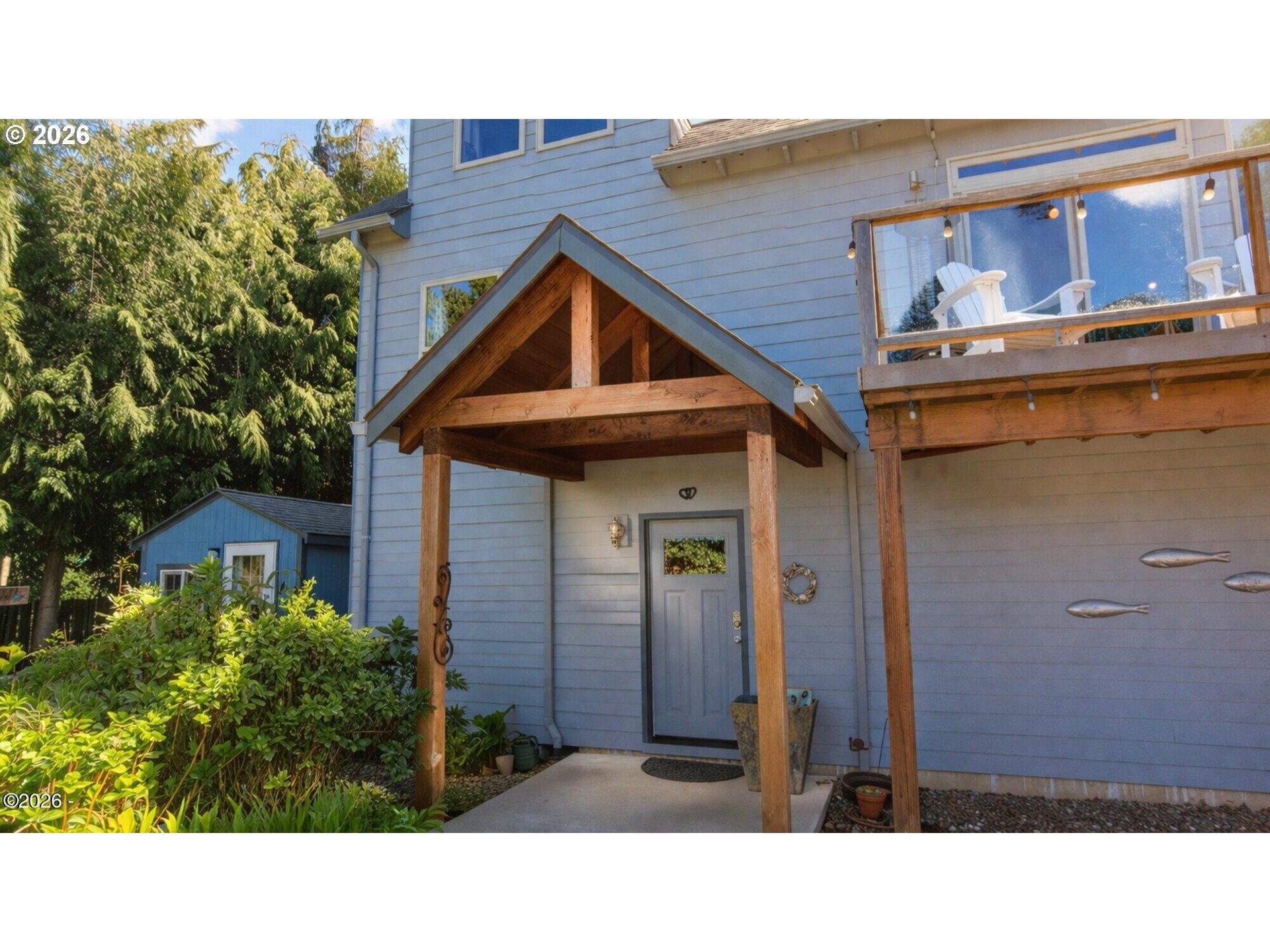 15 Shell Street Yachats, OR 97498 - Photo 4 of 47 a black and white house with a outdoor space