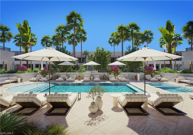 a view of a backyard with furniture and a garden