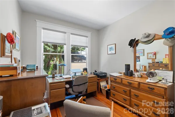 a room with gym equipment and a large window