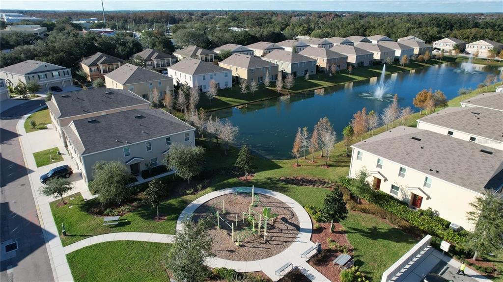 3731 Seneca Club Loop, Unit B Orlando, FL 32808 - Photo 23 of 32 an aerial view of a house with outdoor space and lake view