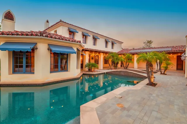 a large kitchen with kitchen island granite countertop lots of counter space and glass windows
