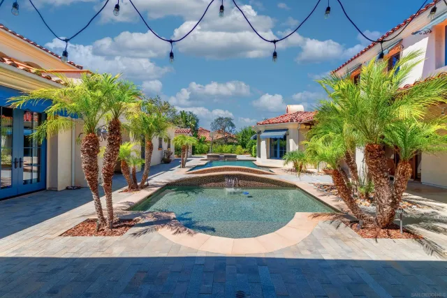 a kitchen with a stove a faucet and a sink