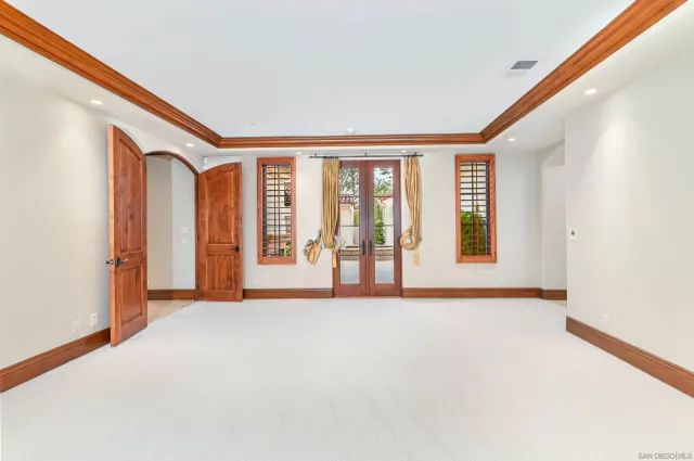a view of staircase with white walls and a window